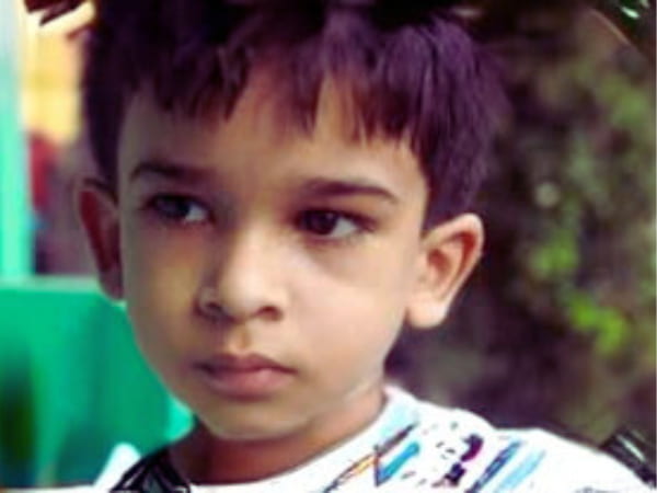 Young South Asian boy with a thoughtful expression outdoors, representing a documented case of children who remember past lives, known as the Imad Elawar reincarnation case from Lebanon.