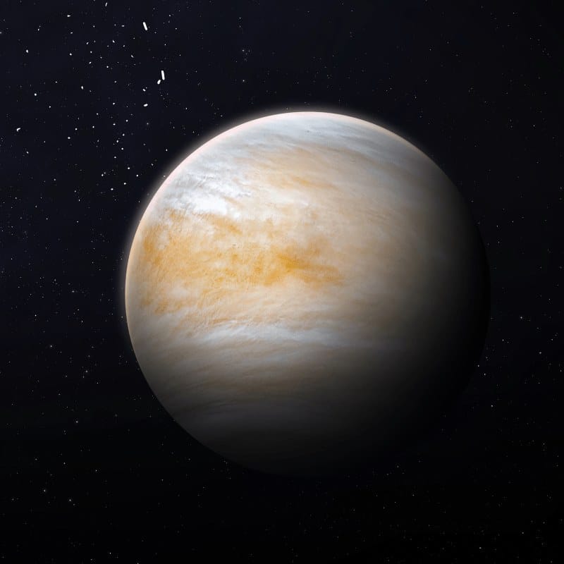Unexplained Events 2026: realistic rendering of Venus with swirling amber and golden atmospheric clouds against deep space