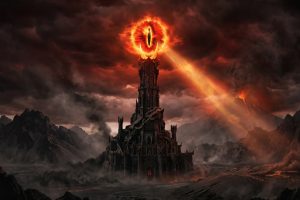 Flaming supernatural Eye of Sauron atop the dark fortress of Barad-dûr, casting a glowing beam of light over the volcanic ash landscape of Mordor.